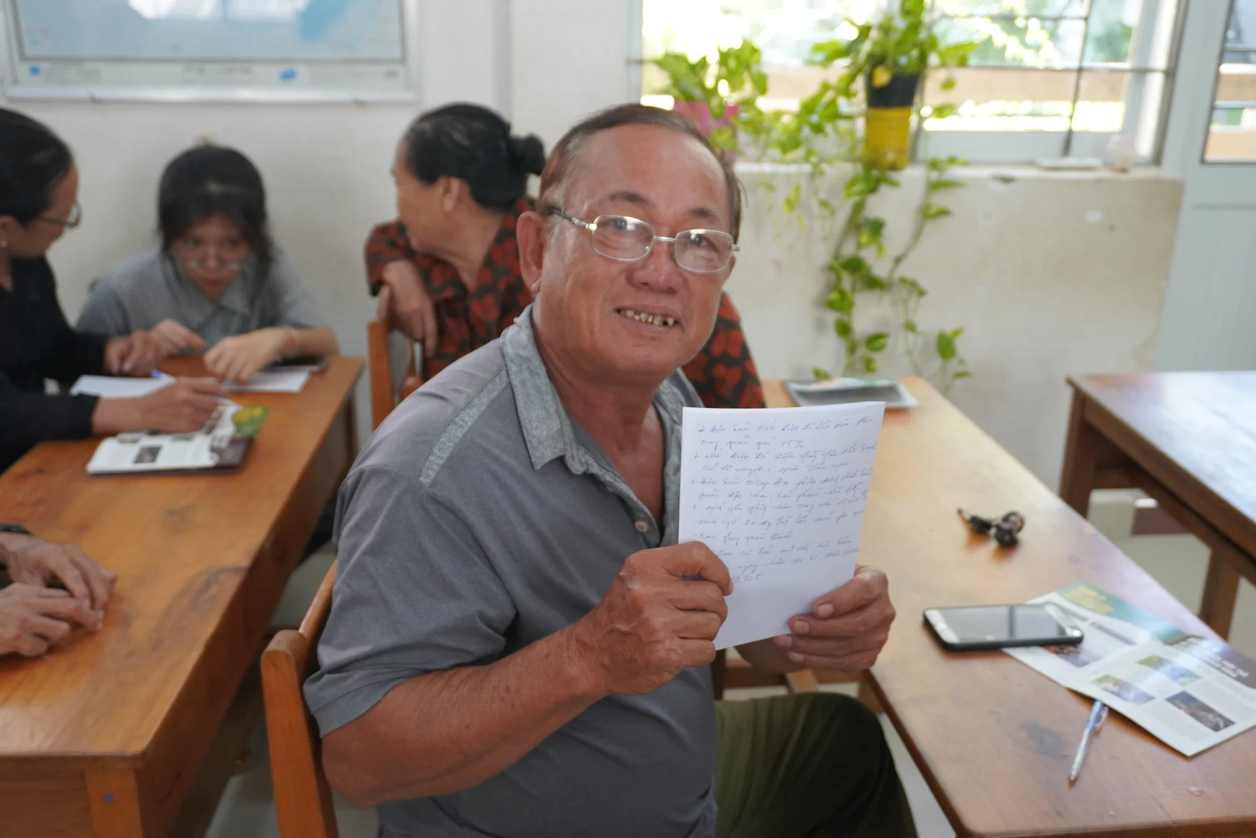 A participant shares his work during the workshop.